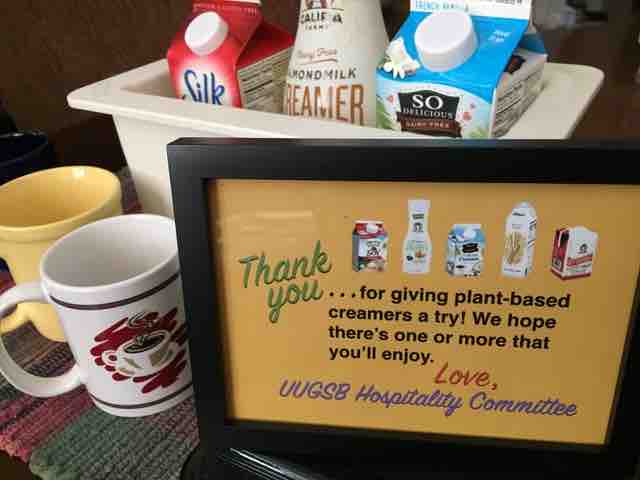 Tabletop sign says, "Thank you for giving plant-based creamers a try! We hope there's one or more that you'll enjoy. Love, UUGSB Hospitality Committee"